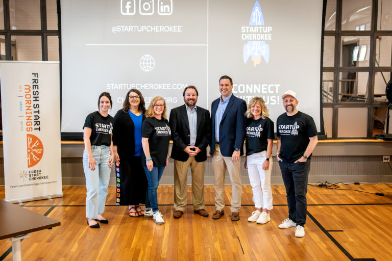 Group of entrepreneurs and community leaders at Startup Cherokee rebrand launch event in Cherokee County, GA.